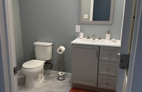 Aurora House | The room has bathroom and king size bed and a shared living room. Super cozy!