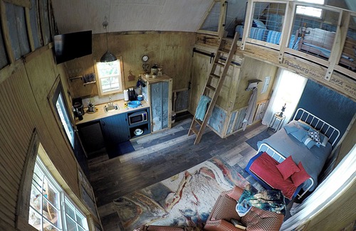 Mentone Cottage | The Treehouses on wooded acreage that overlook a large lake.