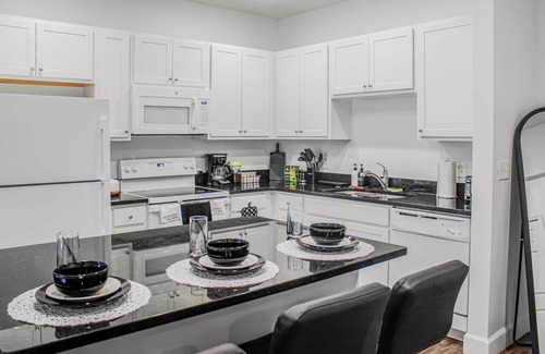 Kissimmee Apartment | The Tuxedo 2BD Stay in Kissimmee with fitness room, Free WIFI, Free Parking