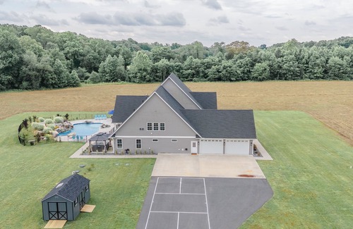 Denton House | The Wilder Way with a beautiful pool, hot tub, and a pickleball court!