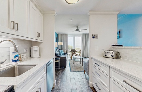 West Beach Village Villa | Third floor home with stunning private-deck ocean views - steps from beach
