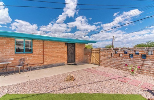 The Garden District House | This centrally located 1 bedroom features a full size pool and electric vehicle charging on site.