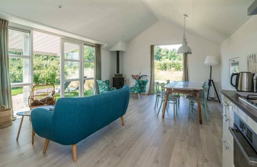 Westenschouwen House | This chalet has an extra spacious living room and two sitting areas, one of which is situated by the