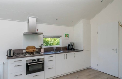 Westenschouwen House | This chalet has an extra spacious living room and two sitting areas, one of which is situated by the