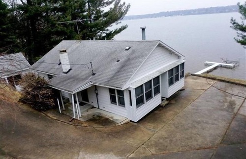 Ludington House | This Cottage offers dramatic views of Hamlin Lake with 150 feet of lakefront