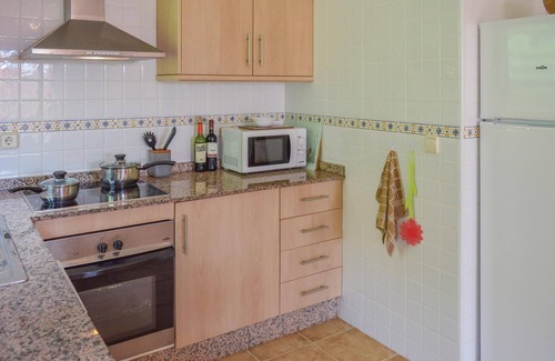 Los Puertos House | This cozy vacation terraced house with terrace is located only 650 meters from the pebble beach and