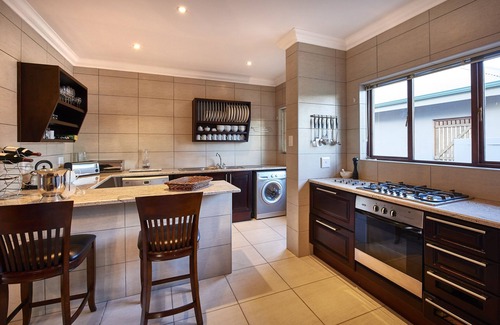 Clarens House | This holiday home has a balcony, stove top and kitchen