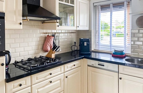 Workum House | This luxury waterfront vacation home is located in a cottage area and close to a boat rental.