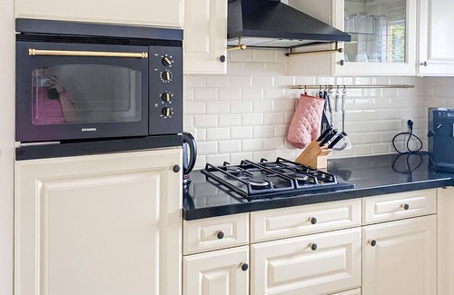 Workum House | This luxury waterfront vacation home is located in a cottage area and close to a boat rental.