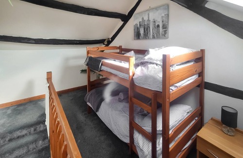 Broughton Mills Cottage | This pretty barn offers much character including oak beams and a gallery bedroom.