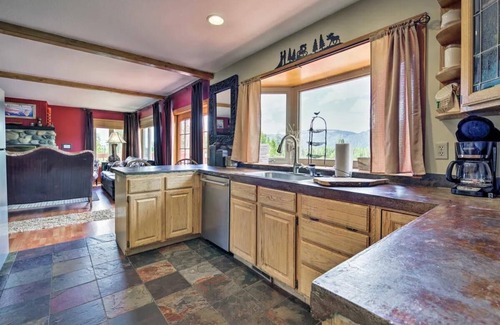 Tamarack Resort Apartment | This private riverfront escape near McCall sleeps 22+! Bar/game room, huge kitchen/dining. Between Tamarack & Brundage, with ride-out snowmobile trail access. Cozy fireplace & big TVs for sports fans.