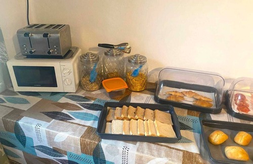 Vilaflor Apartment | This room is a bunk room with two single bunk beds. The bathroom and showers are shared with the two other bunk rooms . The room has a great view of the village square.