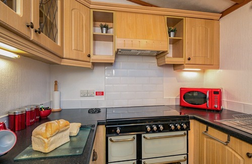 Carnforth Ski Chalet | This traditional two bedroom holiday home one row back from the lake, boasts partial lake views.