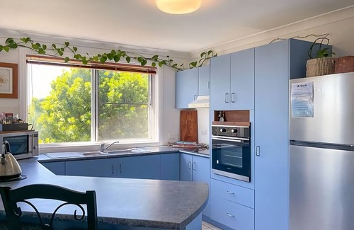 Coffs Harbour Apartment | This unique level home is situated on the upper level in a private setting, with mountain views