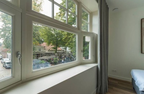 Oirschot Apartment | This unique Oirschot apartment offers stylish comfort with a spacious bedroom and modern amenities