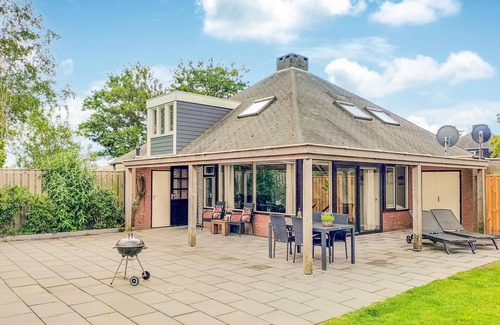 Stavenisse House | This vacation home in Zeeland is in a beautiful location near the water.