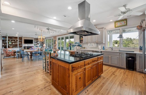 Debordieu Colony House | This vibrant family home features 8 bedrooms, and 8 bathrooms, ocean and creek views