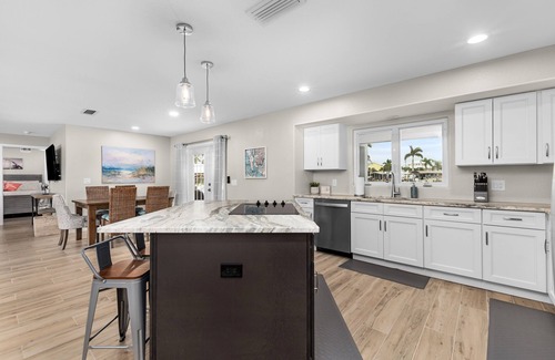 Saint James City House | THREE MASTER SUITES-POOL -WATERFRONT ON CORNER LOT - BOAT LIFT -OUTDOOR KITCHEN