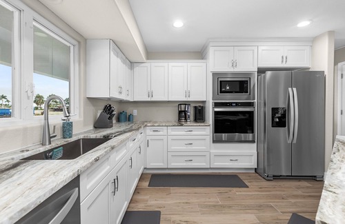 Saint James City House | THREE MASTER SUITES-POOL -WATERFRONT ON CORNER LOT - BOAT LIFT -OUTDOOR KITCHEN