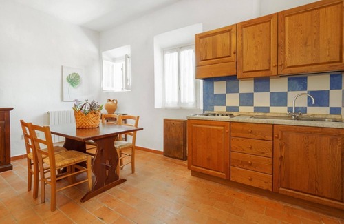 Pian dei Mucini Apartment | Three-room apartment on the ground or first floor in rustic style of approximately 40 m2 furnished in a simple but functional way and located in the village in a large park.It is composed of a living room with sofa and flat-screen television, kitchenette