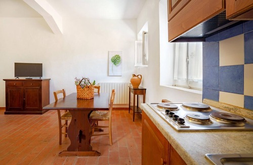 Pian dei Mucini Apartment | Three-room apartment on the ground or first floor in rustic style of approximately 40 m2 furnished in a simple but functional way and located in the village in a large park.It is composed of a living room with sofa and flat-screen television, kitchenette