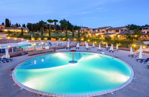 Pian dei Mucini Apartment | Three-room apartment on the ground or first floor in rustic style of approximately 40 m2 furnished in a simple but functional way and located in the village in a large park.It is composed of a living room with sofa and flat-screen television, kitchenette