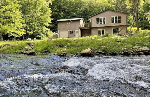 Westby House | Timber Coulee Creek in backyard, king size bed, grill on deck, large garage.