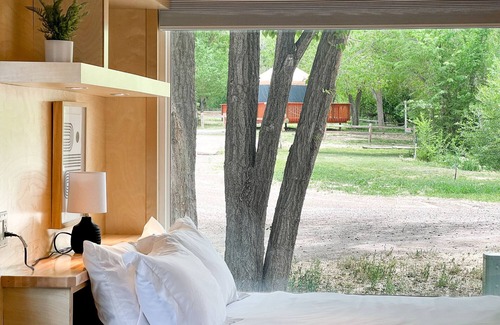 Montrose House | Tiny home with one lofted queen bed and full size futon.