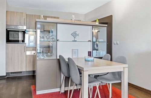 Wremen Apartment | Tolle Ferienwohnung in Strandnähe mit Sauna und Balkon mit Land- und Meerblick