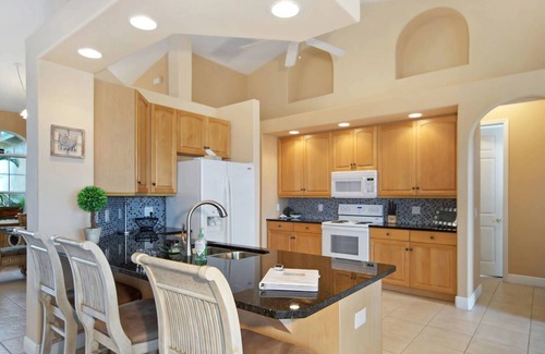 Burnt Store House | Tommy Bahama-style electric-heated pool home on Gulf-access canal - Villa Ellis