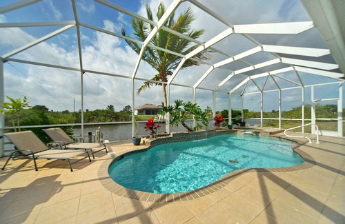 Burnt Store House | Tommy Bahama-style electric-heated pool home on Gulf-access canal - Villa Ellis