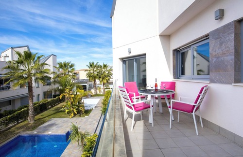 Torrevieja Apartment | Top floor apartment with sunny roof terrace, heated pool and garden