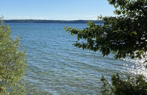 Alden House | Torch Lake Log Cabin, optional Malibu boat rental. Book now August specials!