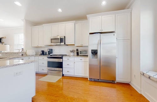 South Bethany Harbor House | Town of South Bethany canal-front home with 2 balconies, firepit, & kayaks