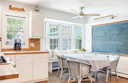 Sag Harbor House | Traditional-style home with pops of patterns and vibrant colors, private.