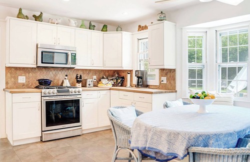 Sag Harbor House | Traditional-style home with pops of patterns and vibrant colors, private.