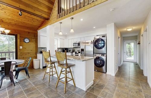 Livingston House | Tranquil lake cabin with private waterfront, modern kitchen, deck & sunset views