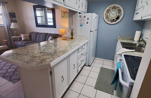Sunset Beach Condo | Treasure Island Getaway 1/1 with water views and on-site pool!
