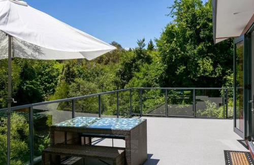 Waipahihi House | Treetop Living, Peaceful 4BR With Scenic Bush Views