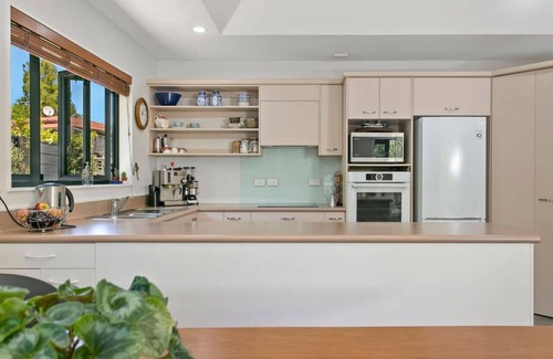 Waipahihi House | Treetop Living - peaceful oasis, serene and cozy interior, scenic views of native bush.