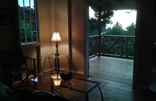 Toucari Cottage | Treetops. A beautiful timber cottage, sea view, private and close to the beach.