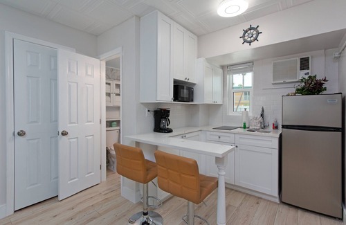 Capri Isle Apartment | Tropic Terrace Suite #16 - Beachfront Resort