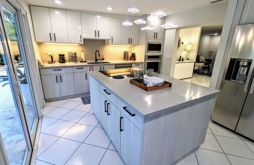 North Palm Beach House | Tropical Escape: King Bed+Heated Pool+Grill + 3 bed/2 bath + Sleeps 8