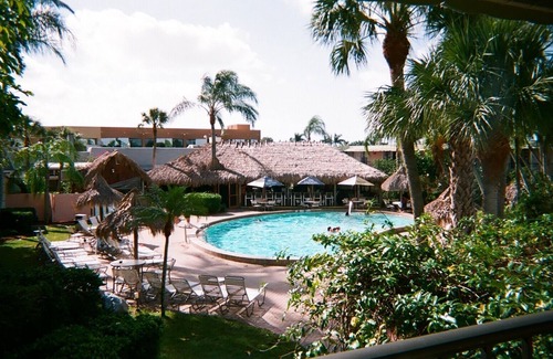Moorings Condo | TROPICAL GROUNDS AND GREAT AMENITIES, 1 MILE BEACH. 3 RESTAURANTS ON PROPERTY.