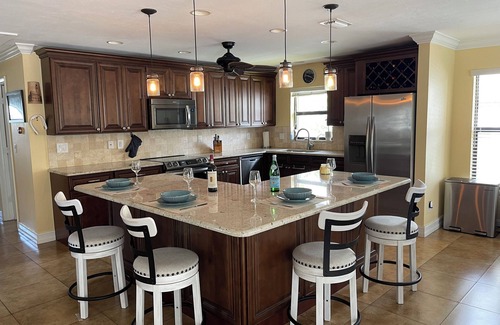 Caloosahatchee House | Tropical Poolside Escape in Cape Coral