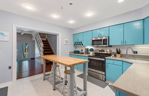 Whitney Beach House | Tropical Retreat Near AMI & IMG | Outdoor Kitchen