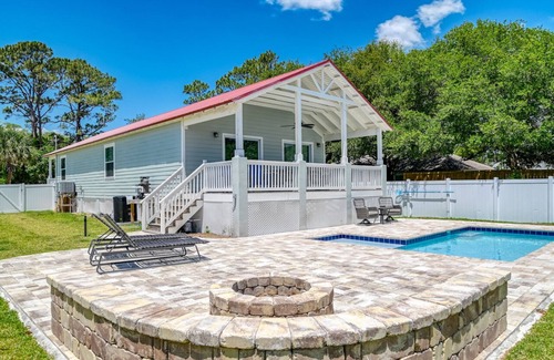 Butler Beach House | Tropical Winds - Heated Pool & Firepit! Walk to the Beach!
