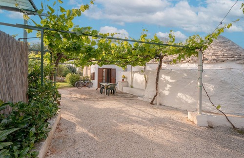 Fasano House | Trullo 'Negli Ulivi' with Private Terrace, Wi-Fi and Air Conditioning
