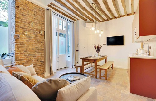 Quartier Sainte-Avoye Apartment | Truly Marais !Set in a passage flowered setting with beautiful colored windows.