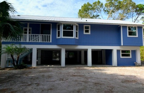 Englewood House | Tucked Away on Wooded Way located blocks from Manasota Beach with Heated Pool.